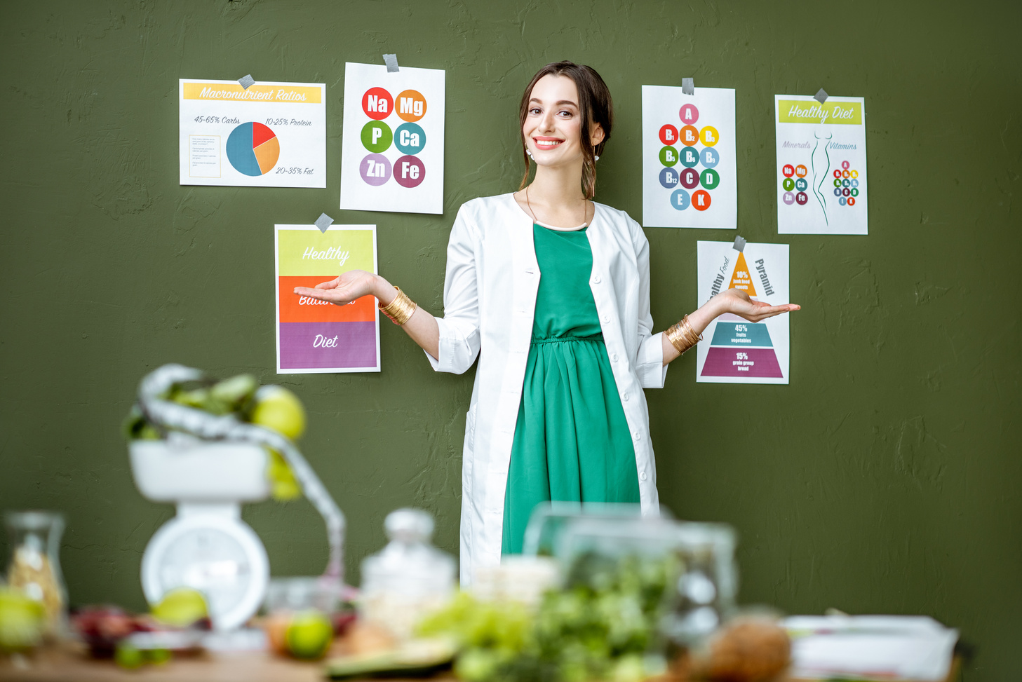 Dietitian with Charts About Nutrition